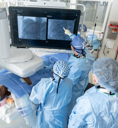 Interventional radiologists performing a procedure